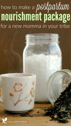 there is a cup with some tea in it next to a jar and spoon on the table