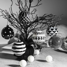 black and white photograph of ornaments on table