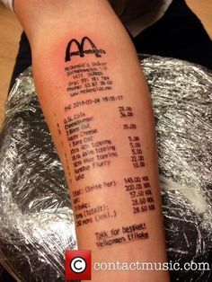 a mcdonald's receipt tattoo on the arm