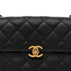 This is an authentic CHANEL Lambskin Quilted Small Chain Flap in Black. This petite shoulder bag is crafted of diamond-quilted lambskin leather in black. The bag features a leather-threaded aged gold chain top handle and shoulder strap and a textured aged gold Chanel CC turn-lock. This opens to a pink fabric interior with a zipper pocket. Chain Top, Gold Chanel, Leather Thread, Pink Fabric, Lambskin Leather, Gold Chain, Gold Chains, Zipper Pocket, Top Handle