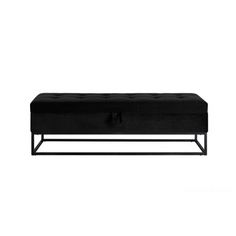 a black bench sitting on top of a white floor next to a metal frame shelf