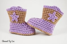 a pair of crocheted baby boots with bows