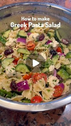 a bowl filled with pasta and vegetables on top of a table