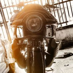 a close up of a motorcycle parked in a garage