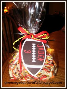 a bag filled with candy sitting on top of a wooden table