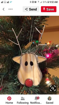 a christmas ornament hanging from the top of a tree