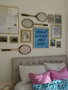 a bed with lots of pictures and tennis rackets on the wall