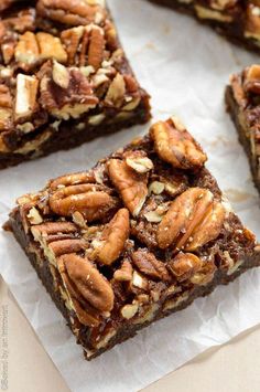 four pieces of brownie with nuts on top