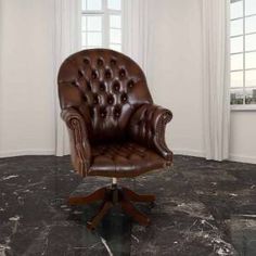 a brown leather office chair sitting on top of a black marble floor next to a window