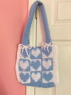 A cute tote bag to hold your things. Cute Handmade Square Crochet Bag, White Crochet Tote Bag For Shopping, Cute Everyday Crochet Rectangular Bag, Cute White Bucket Shoulder Bag, Cute Blue Bags For Vacation, Blue Rectangular Crochet Bag For Gift, White Square Crochet Bag For Shopping, Blue Crochet Shoulder Bag Gift, Trendy Blue Crochet Tote Bag