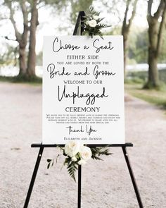 a wedding welcome sign with flowers on it