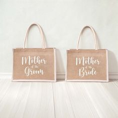 two burlap bags with mother of the bride and groom written on them