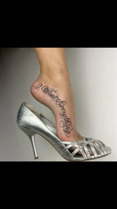 a woman's foot with a tattoo on it