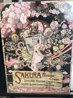 the sign for sakiura blossom cream is decorated with pink flowers and an ice cream sundae