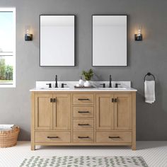 a bathroom with two sinks and mirrors on the wall next to a rug in front of it