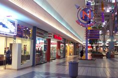 an empty shopping mall filled with lots of shops