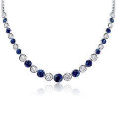 This 12.98 CT. TW Classic Blue & White Bezel Round Tennis Necklace is a stunning piece of jewelry for women. Crafted with precision and care, it features a beautiful combination of blue and white round-cut stones in a bezel setting. This timeless necklace is perfect for any occasion and will add a touch of elegance to any outfit. 🔴 Necklace Information 🔴 Metal:925 Sterling Silver Total Weight:18.20 g Chain Length:17'', 18'' Rhodium:Yes. Give Platinum appearance Nickel Free:Yes 🔴 Gem Information 🔴 Gem Type:Sapphire Stone Color:Blue & White Carat Stone Weight:12.98 CT.TW. Stone Cut:Round Stone Setting:Bezel *All stone weights (CT.) are approximate and listed as diamond equivalent weight in carats. Also total weight of the ring, ring band width & thickness may have a slight deviation no m Timeless Necklace, Show Beauty, Art Deco Pendant, Tennis Necklace, Stone Setting, Sapphire Stone, Stone Cuts, Ring Band, Ring Ring