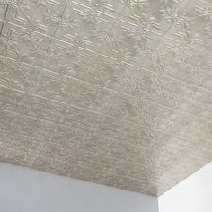 the ceiling is decorated with intricate embossing