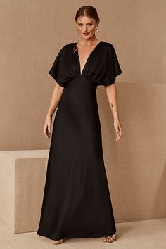 Timelessly elegant, this satin maxi dress pairs a gracefully draped bodice with soft sleeves and a flowy skirt. A daring plunge neckline completes the look.Only available at BHLDN Bhldn Bridesmaid, Charmeuse Dress, Black Bridesmaid, Draped Bodice, Black Bridesmaids, Wardrobe Goals, Mom Wedding, Black Satin Dress, Black Bridesmaid Dresses