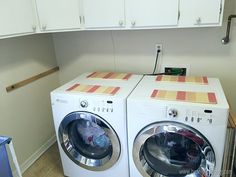 a washer and dryer in a laundry room next to each other on the floor