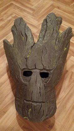 a groote mask sitting on top of a wooden floor