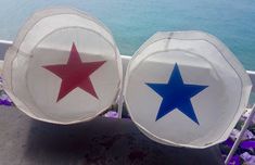 two paper plates with red, white and blue stars on them sitting next to each other