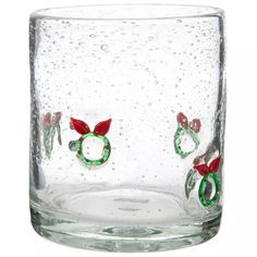 a close up of a glass with water and christmas decorations on the inside of it