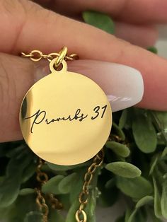 A beautiful 18k gold plated 18" disc necklace engraved with Proverbs 31 on one side and "A woman who fears the Lord is to be praised" on the other side. Charms are gold plated over stainless steel. Plated jewelry is a wonderful, affordable way to add a sophisticated look to your wardrobe, with the look of real gold. It is also an excellent choice for people with sensitive skin. CARE TIPS: Avoid contact with perfumes, body oils, and other chemicals, including household cleaners. Never use chemica Inspirational Nickel-free Gold Necklace, Gold Promise Jewelry With Birth Flower, Meaningful Gold Jewelry For Promise, Meaningful Gold Promise Jewelry, Inspirational Gold Round Pendant Jewelry, Womens Retreat Gifts, Proverbs Woman, Bible Verse Necklace, Retreat Gifts