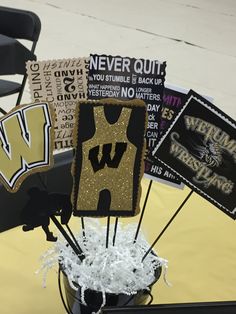 there are some decorations on the table for a game day party or graduation celebration at school