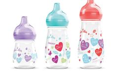 three baby bottles with hearts on them, one is pink and the other is blue