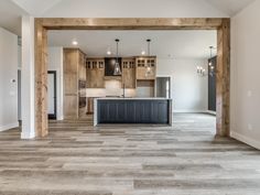 an empty kitchen and living room in a house