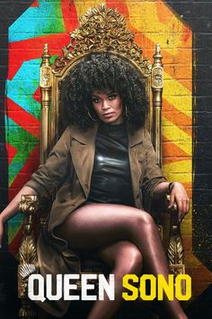 a woman sitting on top of a golden chair in front of a wall with the words queen sono