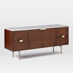 the sideboard is made from wood and marble