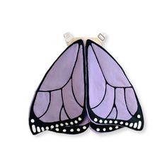 two purple and black butterfly wings with white dots