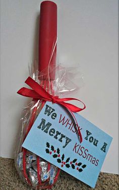 we wish you a merry kissmas candy in a plastic bag with a red candle