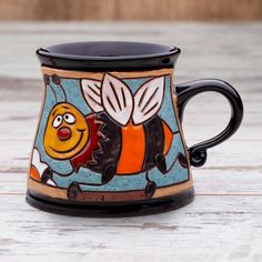 a ceramic mug with a cartoon character on it