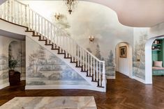 a staircase in a house with wallpaper on the walls