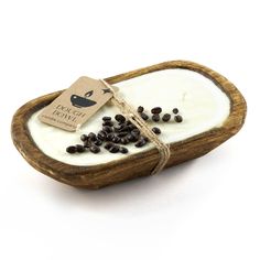 a soap dish with black seeds in it