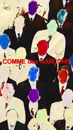 a group of people standing next to each other with the words comme des garcons on them