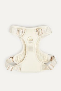 the back of a white dog harness