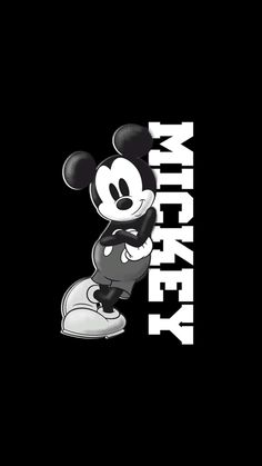 the mickey mouse logo is shown on a black background with white letters and an image of it