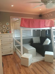 a loft bed with a couch underneath it