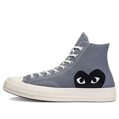 The Comme des Garçons PLAY x Converse Chuck 70 High 'Steel Gray' is a reimagined classic with a modern twist. The grey canvas upper is adorned with an oversized heart and eyes logo in black and white, adding a pop of contrast and visual interest. The dual-branded Ortholite sockliner provides lightweight cushioning and support, while the Egret-colored rubber midsole ensures comfort and durability. The high-top silhouette is completed with a diamond-traction rubber outsole for added grip. Converse Shoes Outfit, Heart Converse, Converse X Comme Des Garcons, Play X Converse, Converse Comme Des Garcons, Black Canvas Shoes, Garcons Converse, Grey Converse, All Nike Shoes