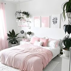 A photo of a pink and white adult bedroom. The walls are white and the decor is soft pink. The bed is made up with white bedding and pink pillows. There are beautiful pink and white art frame paintings and there are plants on the nightstands. The overall effect is calming and inviting Trendy Bedroom, Bedroom Designs, Home Design Decor, Dream Rooms, Designs Ideas, My New Room, Cozy Bedroom