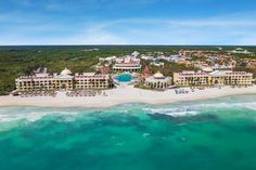 an aerial view of the resort and beach