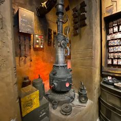 an old fashioned stove sitting inside of a room filled with lots of tools and other items