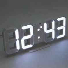 an alarm clock is lit up with the time nine thirty minutes to twelve o'clock