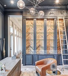 a living room filled with furniture and lots of lights hanging from it's ceiling