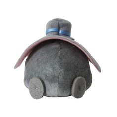 a small gray stuffed animal with a hat on it's head and eyes closed