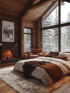 a bedroom with a fireplace and large windows